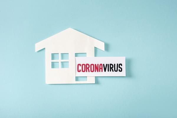 house with a paper that reads coronavirus